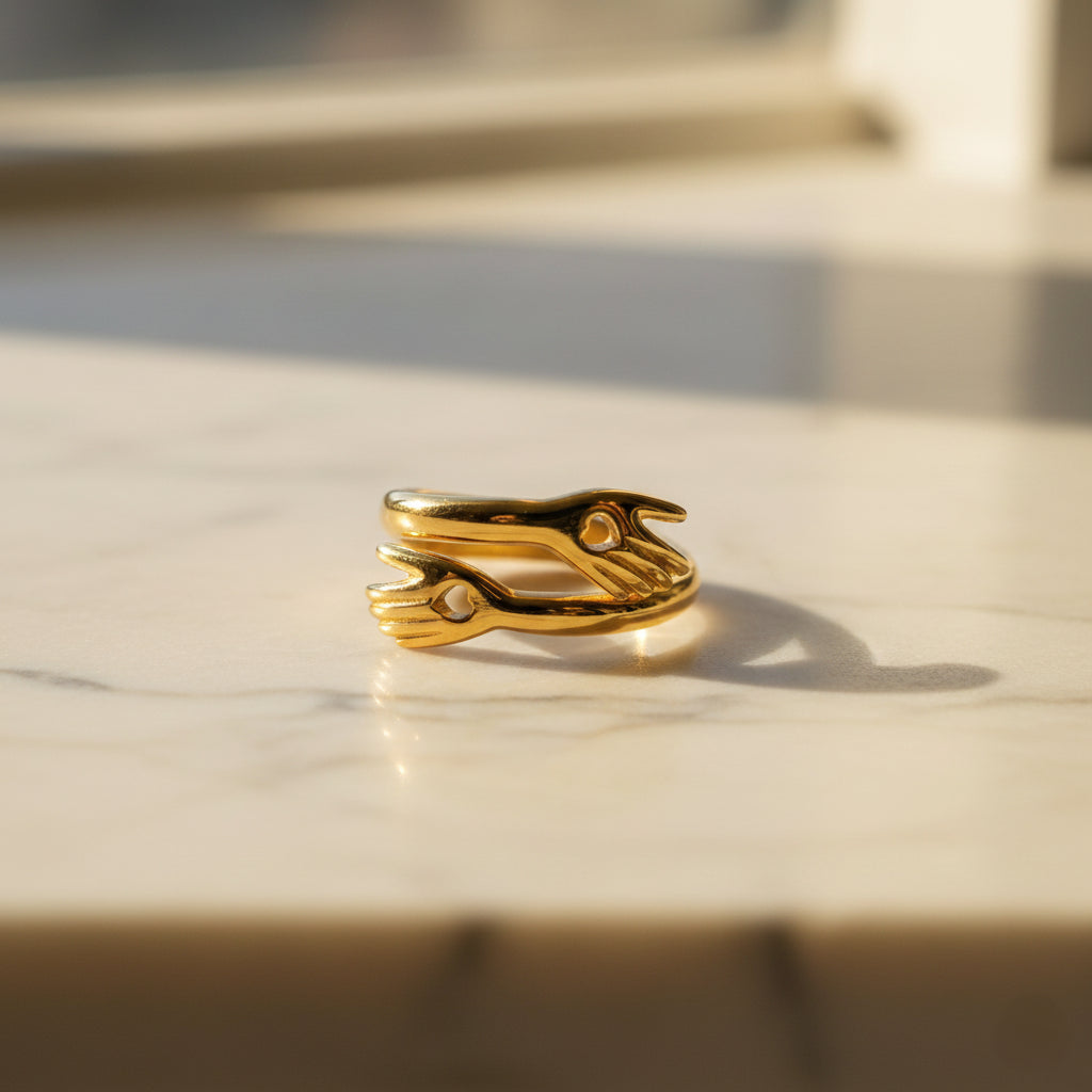 Gold ring with a unique design on a marble surface