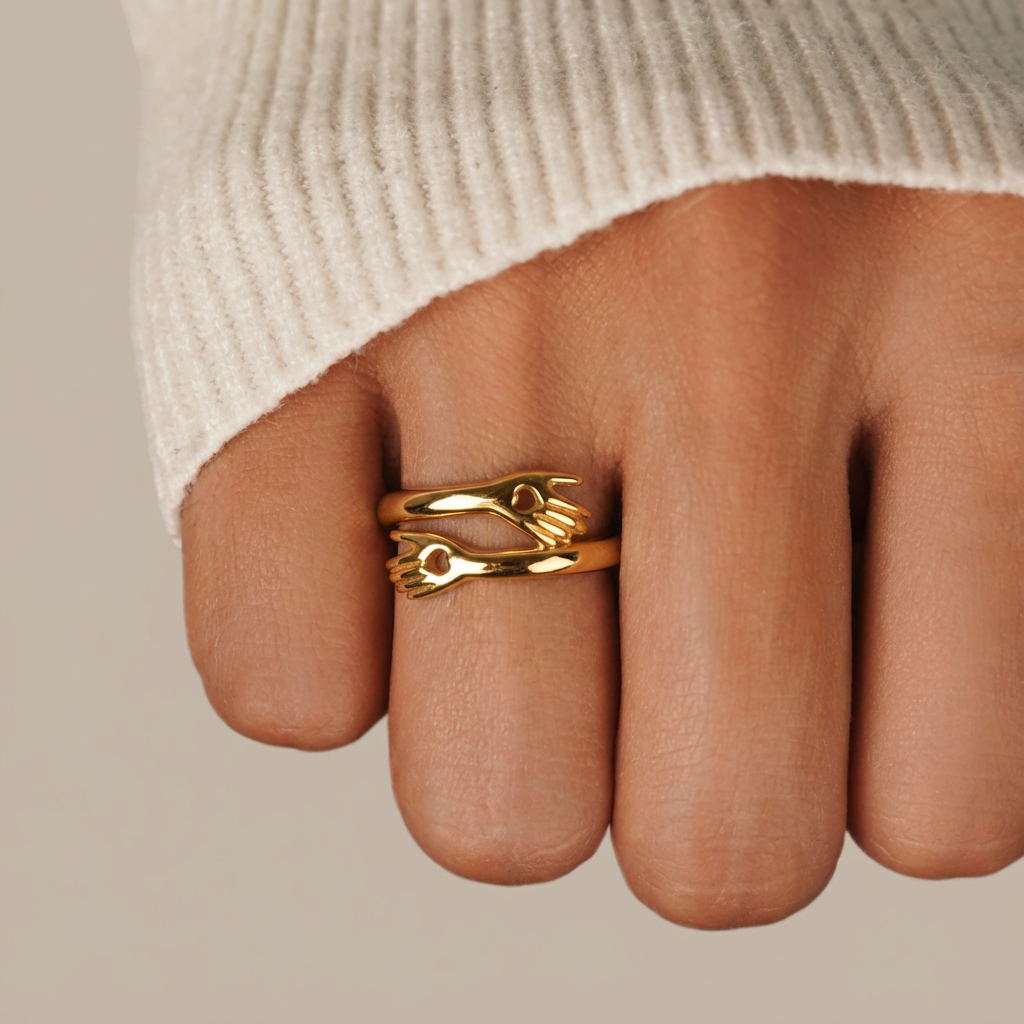 Gold ring on a finger with a neutral background